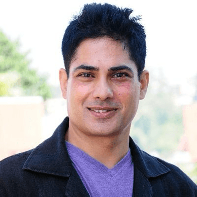 Prem Sapkota smiling in a professional portrait